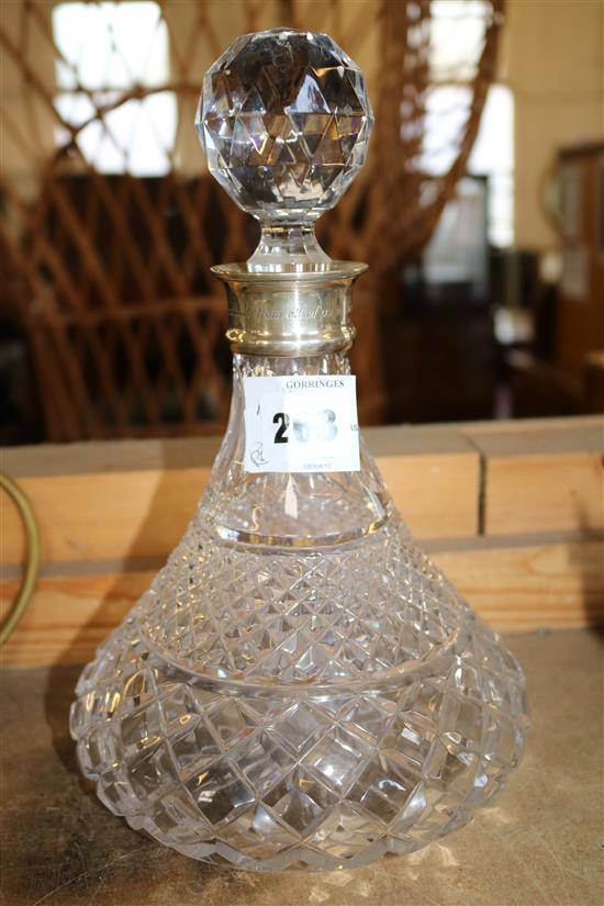 A silver collared glass decanter